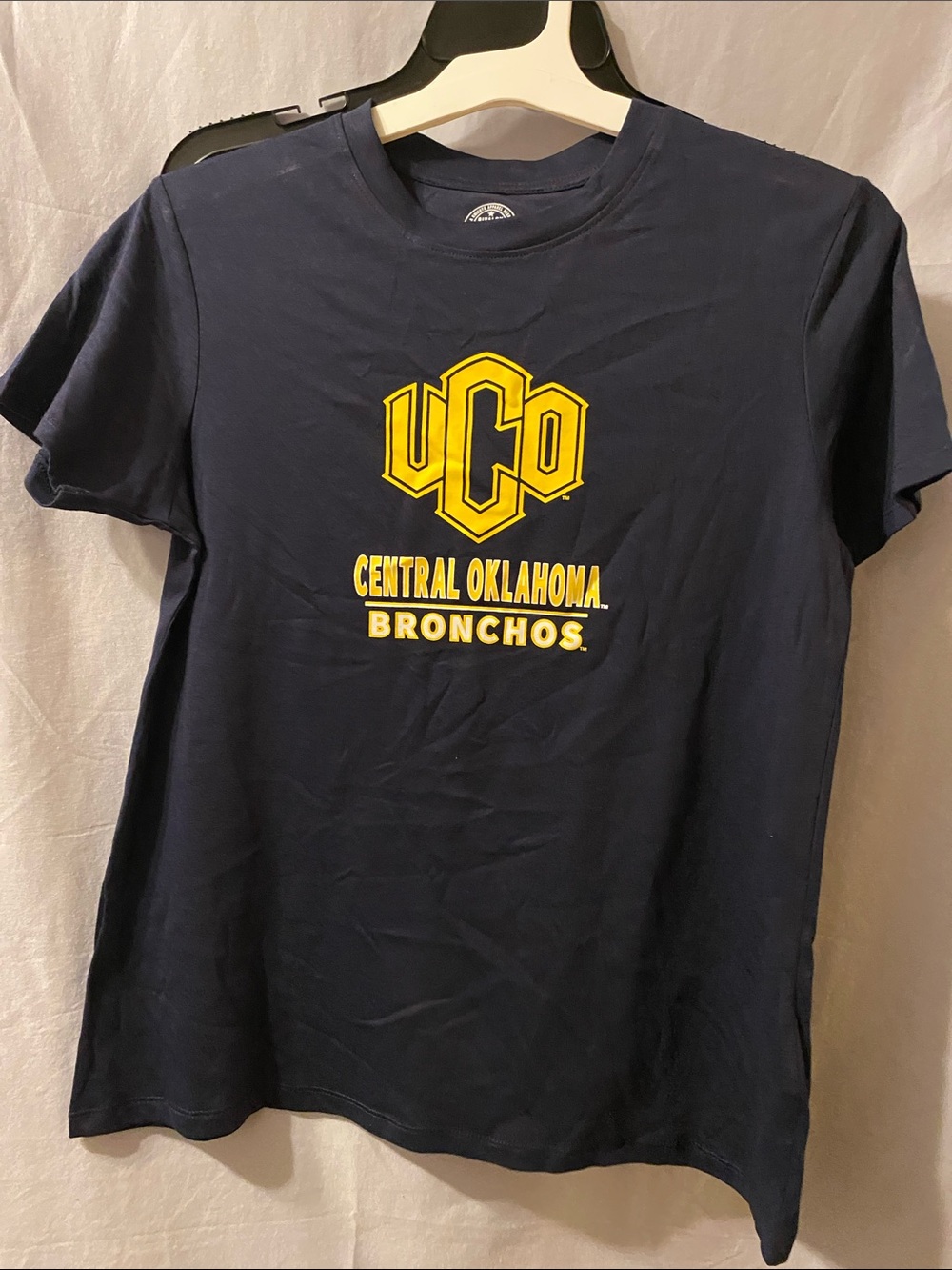 Rivalry Threads Navy Tee with Yellow UCO Central Oklahoma Bronchos Logo